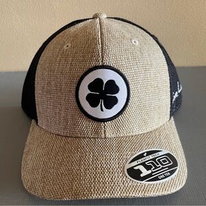 Black Clover "110" Flexfit Tech trucker hat woven front panel & black mesh back.